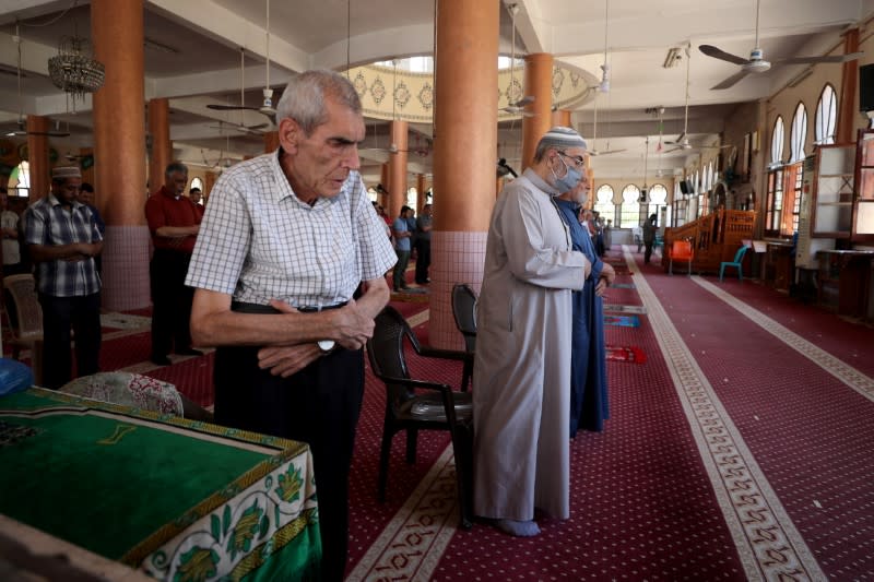 Mosques reopen as Palestinians ease COVID-19 restrictions, in Gaza City