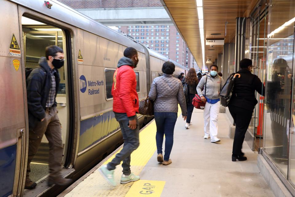 Commuters get off the Metro-North train arriving at 8:39 am in White Plains, which originated at Grand Central Terminal, Oct. 27, 2020.