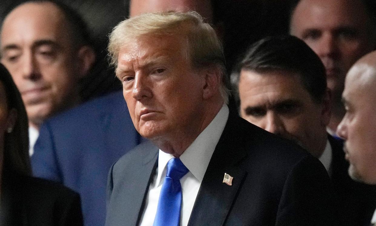 <span>Donald Trump walks out of the courtroom to talk to the media after a jury convicted him at Manhattan criminal court, on 30 May 2024, in New York.</span><span>Photograph: Seth Wenig/AP</span>