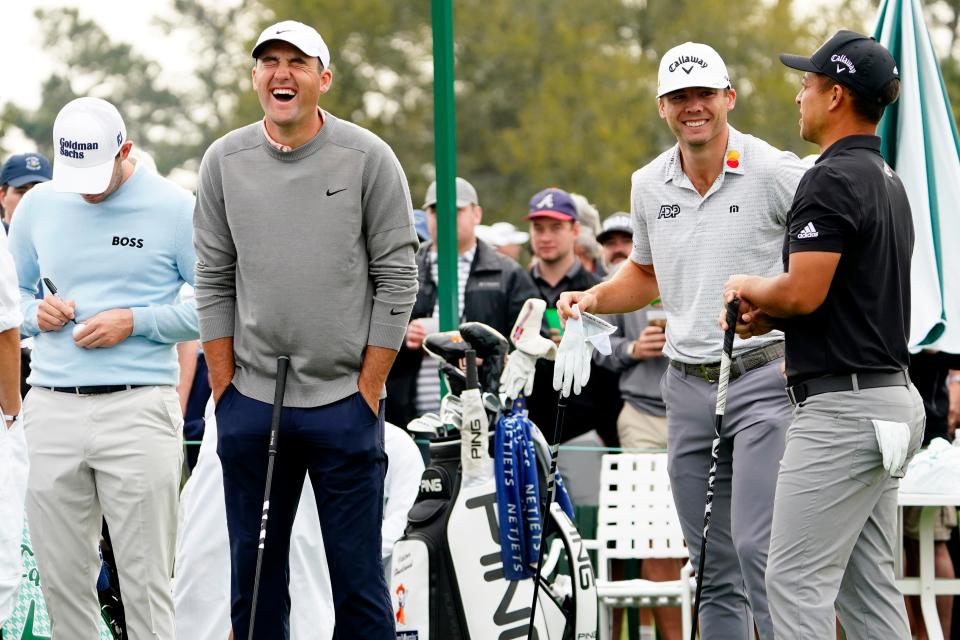 Scottie Scheffler (left), laughs as he prepared for a practice round at the 2022 Masters with Patrick Cantlay, Sam Burns and Xander Schauffele.