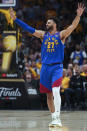 Denver Nuggets guard Jamal Murray reacts during the first half of Game 1 of the basketball team's NBA Finals against the Miami Heat, Thursday, June 1, 2023, in Denver. (AP Photo/Jack Dempsey)