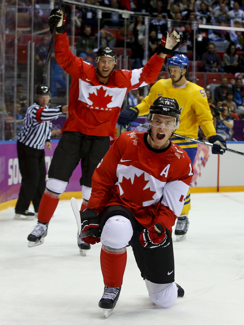 Canada forward Jonathan Toews reacts after scoring a goal against Sweden during the first period of the men's gold medal ice hockey game at the 2014 Winter Olympics, Sunday, Feb. 23, 2014, in Sochi, Russia. (AP Photo/Matt Slocum)