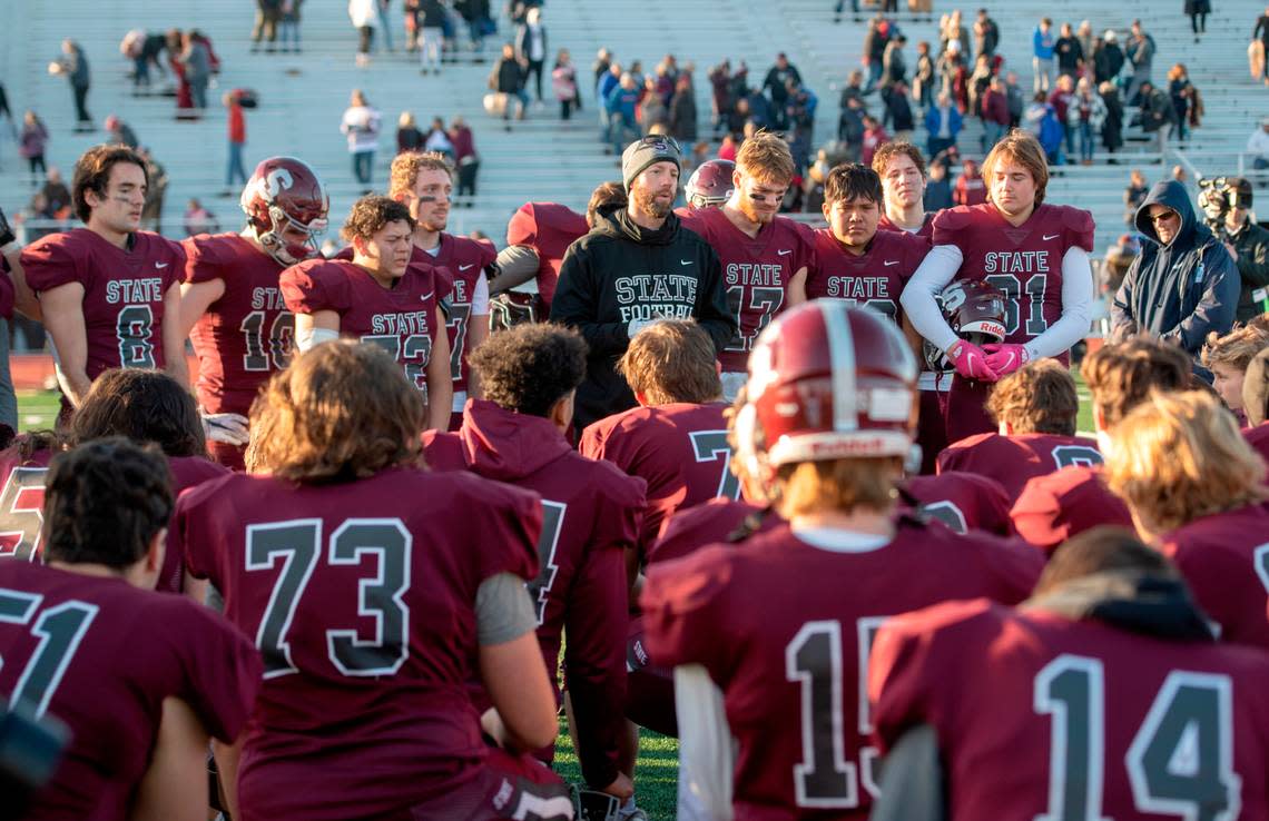 State College football coach Matt Lintal talks to his players and praises the seniors after the loss to Mt. Lebanon in the PIAA class 6A semifinal game on Saturday, Dec. 4, 2021 at Mansion Park.