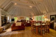 The high ceilings feature exposed wood beams and a massive fireplace can be found in the main living room. Photo: IMP/australscope