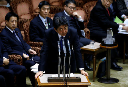 Japan's Prime Minister Shinzo Abe (C) speaks at the upper house parliamentary session after reports on North Korea's missile launches, in Tokyo, Japan, March 6, 2017. REUTERS/Issei Kato