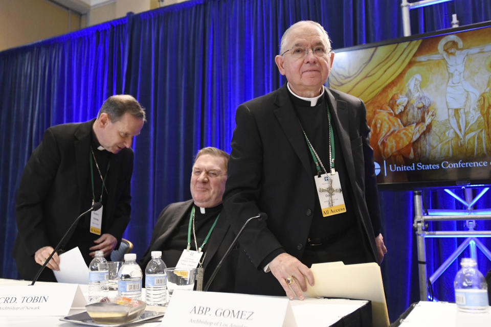 FILE - In this Tuesday, Nov. 12, 2019, file photo, Archbishop Jose H. Gomez, right, of Los Angeles, with Bishop Michael F. Burbidge, left, of Arlington, Va., and Cardinal Joseph William Tobin, of Newark, N.J., exits a news conference after being elected president of the United States Conference of Catholic Bishops during their Fall General Assembly in Baltimore. On Tuesday, Nov. 17, 2020, Gomez addressed an online national meeting of bishops. During the previous week, Gomez congratulated Joe Biden on his presidential election victory. Now, Gomez is sounding a different tone, saying some of Biden’s policy positions, including support for abortion rights, pose a “difficult and complex situation” for the church. (AP Photo/Steve Ruark, File)