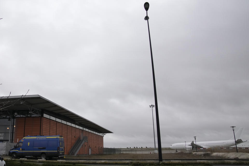 The plane reported to carry some 300 Indian citizens parks at the Vatry airport, eastern France, Saturday, Dec. 23, 2023 in Vatry. About 300 Indian citizens heading to Central America were sequestered in a French airport for a third day Saturday because of an investigation into suspected human trafficking, authorities said. The 15 crew members of the Legend Airlines charter flight en route from United Arab Emirates to Nicaragua were questioned and released, according to a lawyer for the small Romania-based airline. (AP Photo/Christophe Ena)