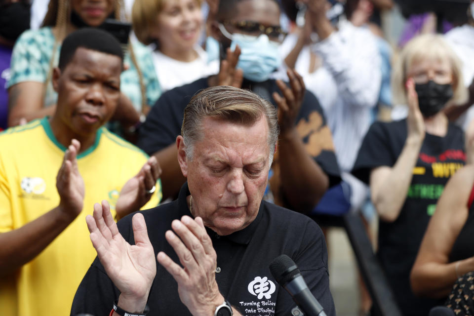 Father Michael Pfleger speaks for first time during a press conference after his reinstatement by Archdiocese of Chicago, Monday, May 24, 2021, in front of St. Sabina Catholic Church in the Auburn Gresham neighborhood in Chicago. (AP Photo/Shafkat Anowar)