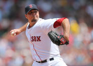 Josh Beckett #19 of the Boston Red Sox throws in the first inning against the Texas Rangers at Fenway Park August 8, 2012 in Boston, Massachusetts. (Photo by Jim Rogash/Getty Images)