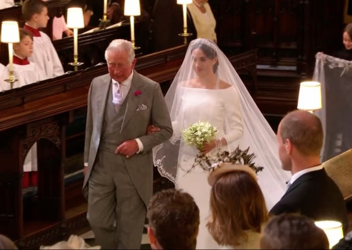 Prince Charles walks Meghan Markle down the aisle at St. George’s Chapel in Windsor Castle on her wedding day - Credit: ASSOCIATED PRESS.