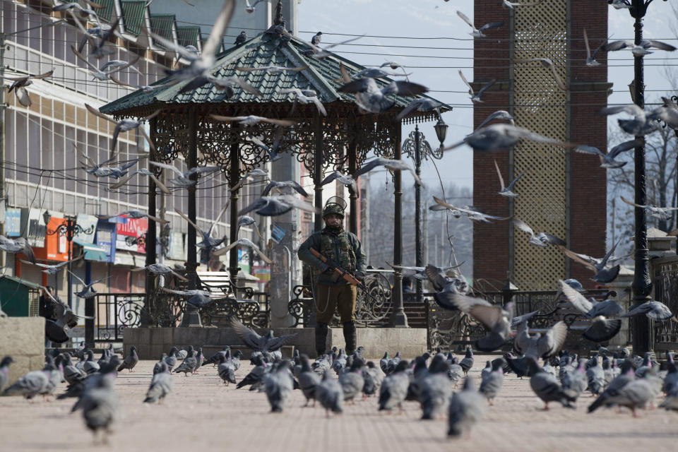 An Indian paramilitary soldier stands guard during a strike in Srinagar, Indian controlled Kashmir, Thursday, Feb. 28, 2019. As tensions escalate between India and Pakistan, shops and business remained closed for the second consecutive day in Indian portion of Kashmir following a strike call by separatist leaders to protest Tuesday's raids on key separatist leaders by Indian intelligence officers. (AP Photo/ Dar Yasin)