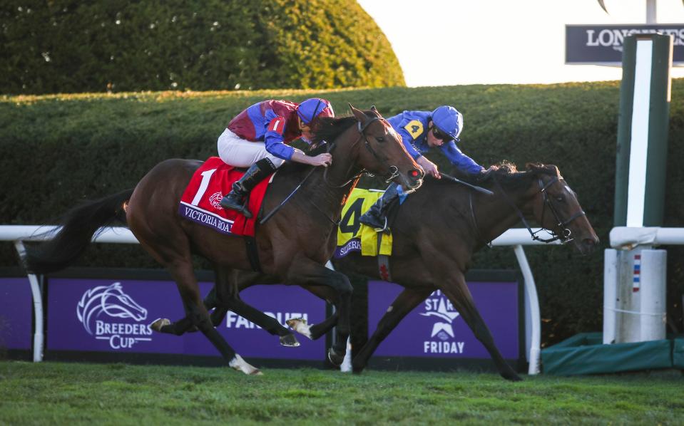 Silver Knott jockey William Buick looks over at winner Victoria Road ridden by Ryan Moore at finish line of the Juvenile Turf race 10 at the Breeders' Cup World Championships at Keeneland in Lexington, Ky. Nov. 4, 2022. 