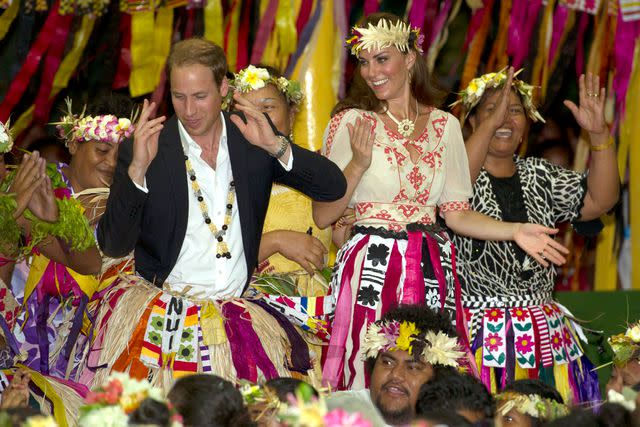 <p>Arthur Edwards - Pool/Getty</p> Prince William and Kate Middleton dance in Tuvalu on Sept. 18, 2012