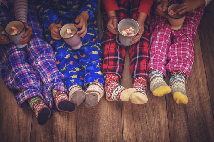 Cute Little Kids in Pyjamas and Christmas Socks Drinking Hot Chocolate with Marshmallows for Christmas