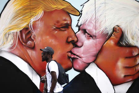 A mural of Donald Trump embracing Boris Johnson is seen on a building in Bristol, Britain May 24, 2016. REUTERS/Peter Nicholls