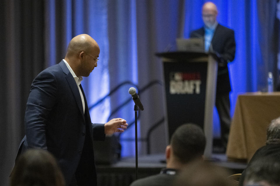 Minnesota Twins assistant director of professional player procurement Navery Moore, left, announces the team's selection in the Rule 5 Draft during the Major League Baseball winter meetings Wednesday, Dec. 6, 2023, in Nashville, Tenn. (AP Photo/George Walker IV)