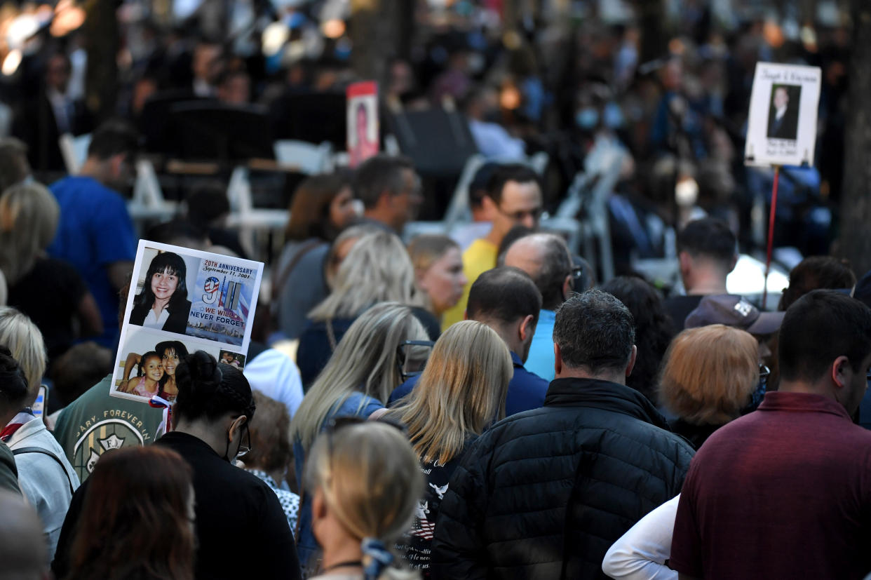 NEW YORK, NEW YORK - SEPTEMBER 11: The photo of a 9/11 victim is carried by family and friends as they attend a ceremony commemorating  the 20th anniversary of the 9/11 attacks on the World Trade Center on September 11, 2021 in New York City. The nation is marking the 20th anniversary of the terror attacks of September 11, 2001, when the terrorist group al-Qaeda flew hijacked airplanes into the World Trade Center, Shanksville, PA and the Pentagon, killing nearly 3,000 people. (Photo by Ed Jones-Pool/Getty Images)