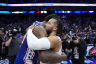 New York Knicks' Jalen Brunson, right, and Philadelphia 76ers' Joel Embiid, left, embrace after Game 6 in an NBA basketball first-round playoff series, Thursday, May 2, 2024, in Philadelphia. (AP Photo/Matt Slocum)
