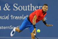 Aug 18, 2017; Mason, OH, USA; Nick Kyrgios (AUS) returns a shot against Rafael Nadal (ESP) during the Western and Southern Open at the Lindner Family Tennis Center. Mandatory Credit: Aaron Doster-USA TODAY Sports