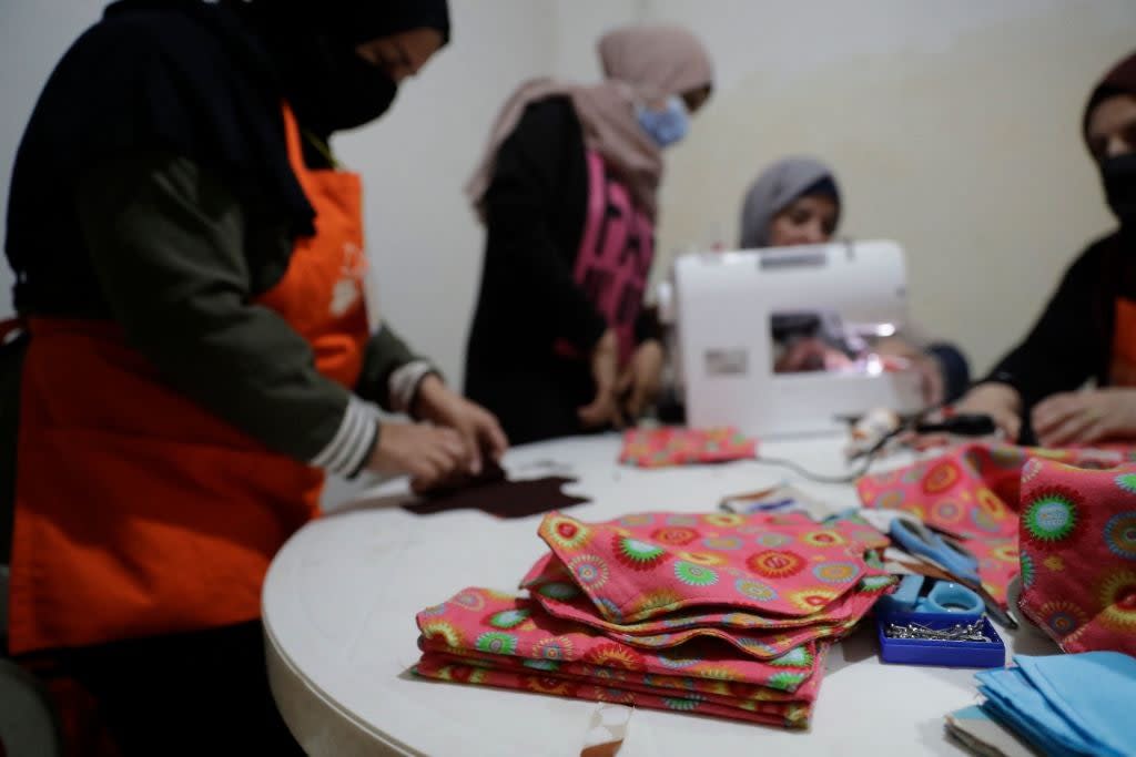 Members of international NGO Days For Girls and local partner WingWoman Lebanon assemble reusable sanitary kits in the Palestinian refugee camp of Shatila (AFP/Getty)