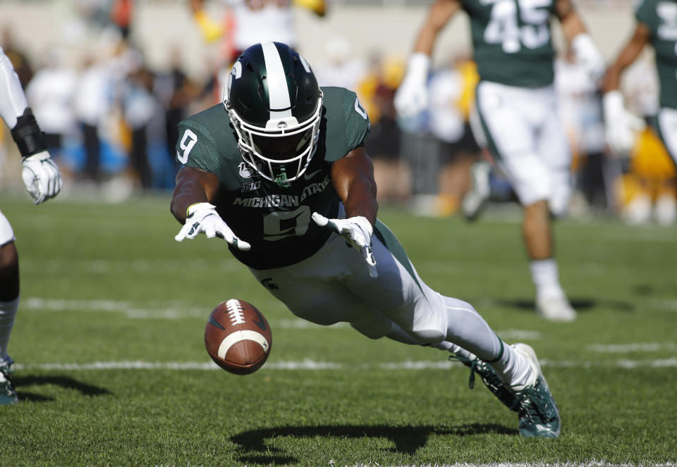 Michigan State's Dominique Long dives for the ball while attempting to down a punt during the first quarter of an NCAA college football game against Arizona State, Saturday, Sept. 14, 2019, in East Lansing, Mich. The ball rolled into the end zone for a touchback. (AP Photo/Al Goldis)