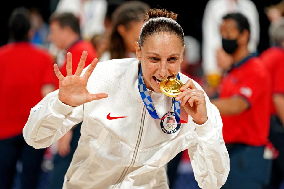 Diana Taurasi celebrates Team USA's championship in women's basketball at the 2020 Tokyo Olympics, the fifth gold medal of her Olympic career.
