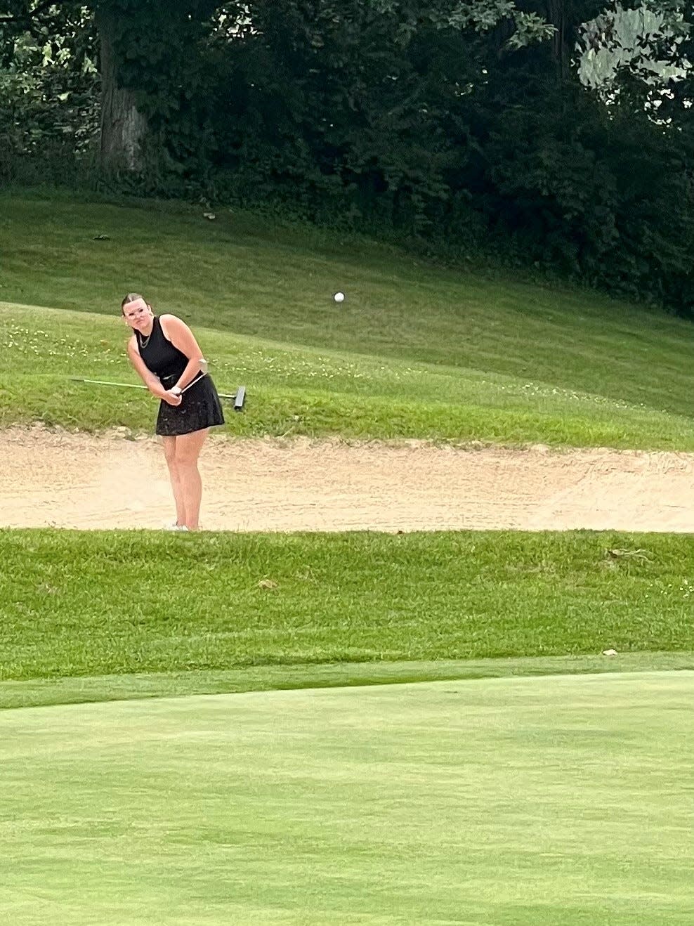 Pleasant's Anna Songer chips onto the green during the Heart of Ohio Junior Golf Association's final tournament of the 2023 season at Valley View.