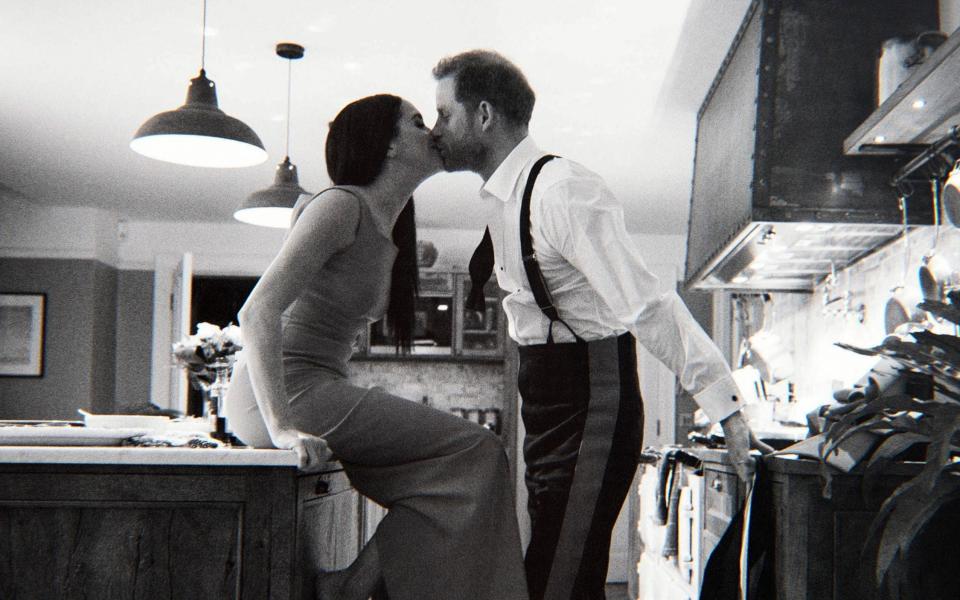 One picture shows Prince Harry and Meghan kissing in their Frogmore Cottage kitchen during the same week - Netflix