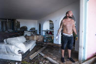 <p>A man reacts as stands in his destroyed home in Orient Bay on the French Carribean island of St. Martin, after the passage of Hurricane Irma, Sept. 7, 2017. (Photo: Lionel Chamoiseau/AFP/Getty Images) </p>