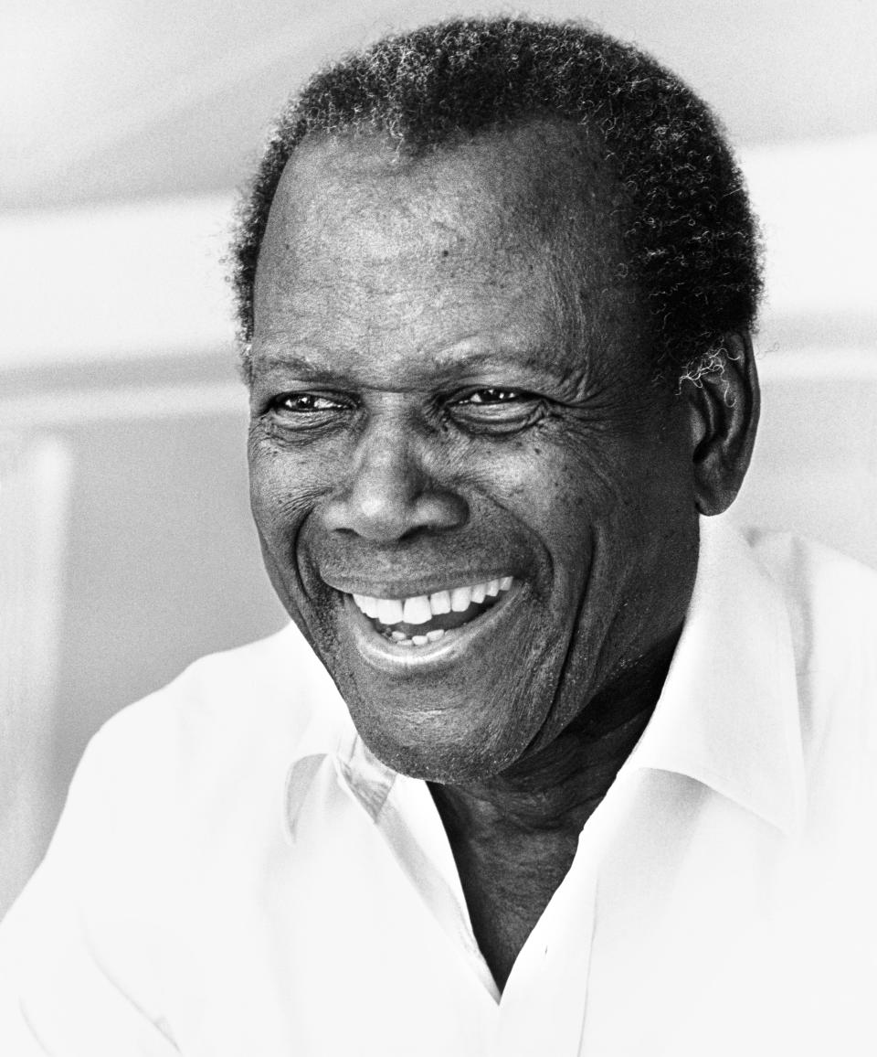 Bahamian-American actor & Civil Rights activist Sidney Poitier (1927 – 2022) as he laughs, at the Hotel du Cap, Antibes, France, 2001. Photo by Ellen Graham/Getty Images.