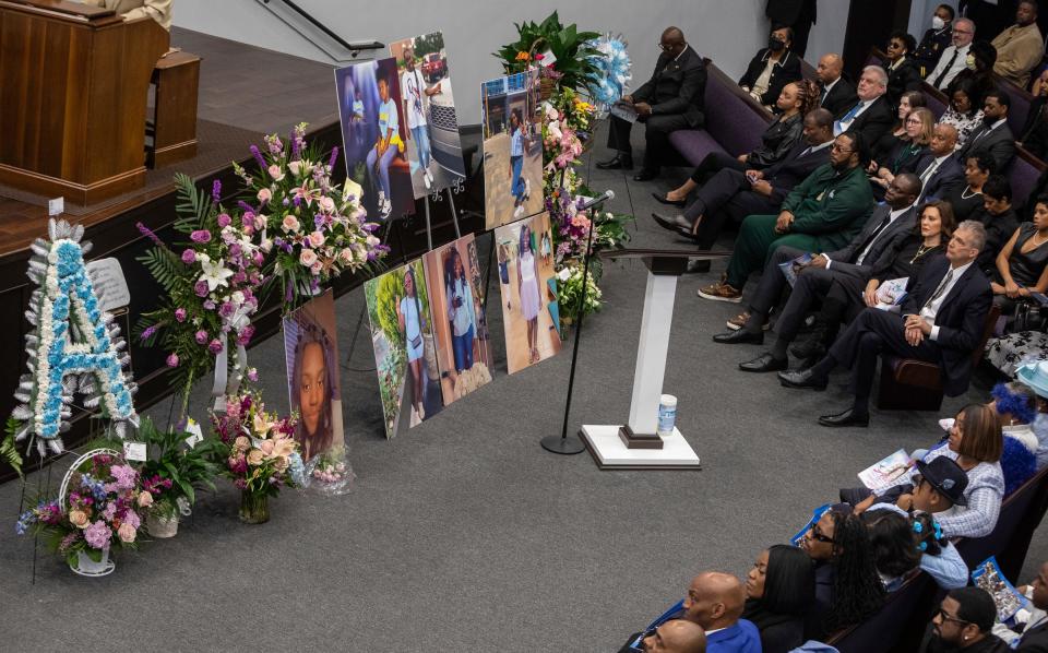 Democratic Gov. Gretchen Whitmer and Lt. Governor Garlin Gilchrist ll sit next to one another inside the Zion Hope Baptist Church during Arielle Diamond Anderson's church service in Detroit on Feb. 21, 2023. Anderson was one of three students killed during a mass shooting at Michigan State University on Feb. 13, 2023.