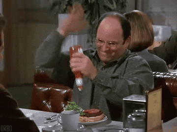 George from "Seinfeld" pouring Ketchup on his burger.