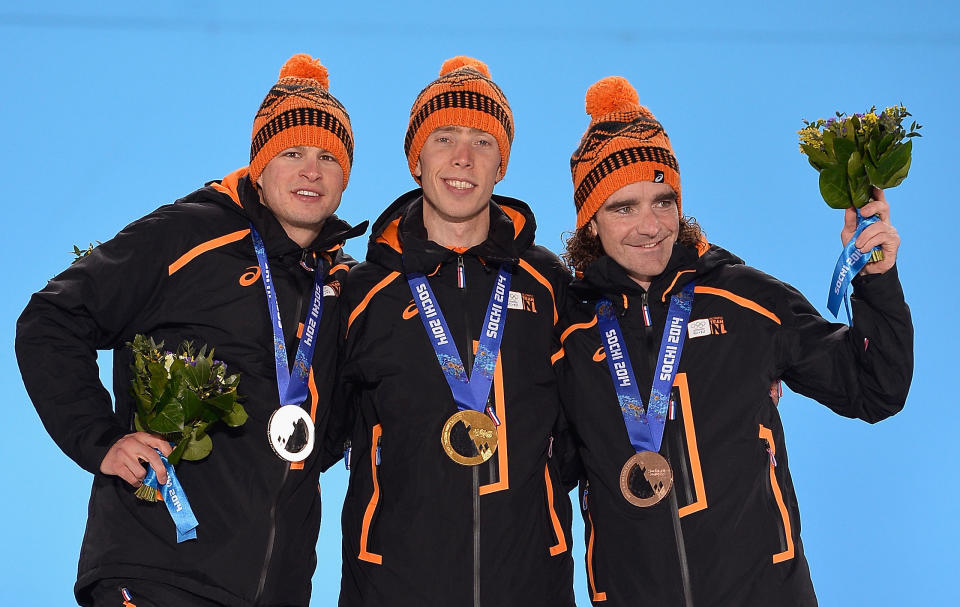 SOCHI, RUSSIA - FEBRUARY 19:  (L-R) Silver medalist Sven Kramer of the Netherlands, gold medalist Jorrit Bergsma of the Netherlands and bronze medalist Bob de Jong of the Netherlands celebrate on the podium during the medal ceremony for the Men's 10000m Speed Skating on day twelve of the Sochi 2014 Winter Olympics at at Medals Plaza on February 19, 2014 in Sochi, Russia.  (Photo by Pascal Le Segretain/Getty Images)