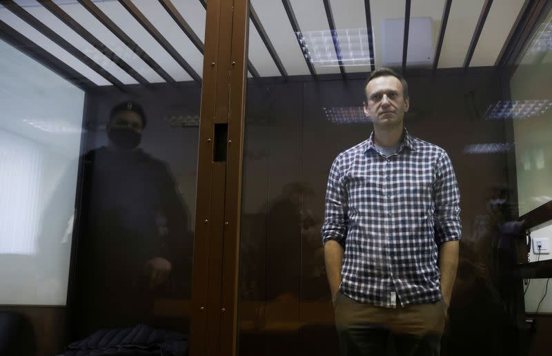 FILE PHOTO: Russian opposition politician Alexei Navalny attends a court hearing earlier to appeal a court decision to change his suspended sentence to a real prison term