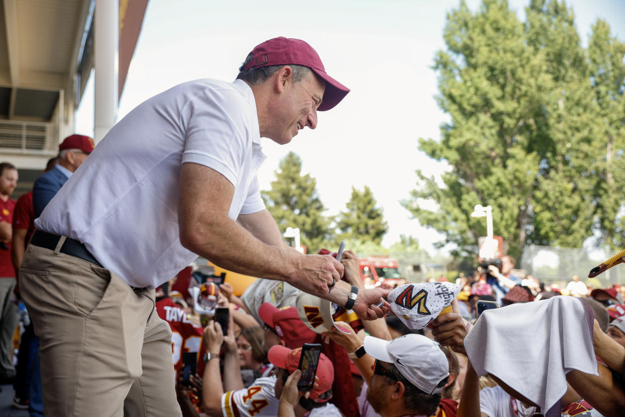 Josh Harris, leader of the new Washington Commanders ownership group, greets fans during a pep rally introducing the owners at FedEx Field on July 21, 2023 in Landover, Maryland. (Photo by Tasos Katopodis/Getty Images)