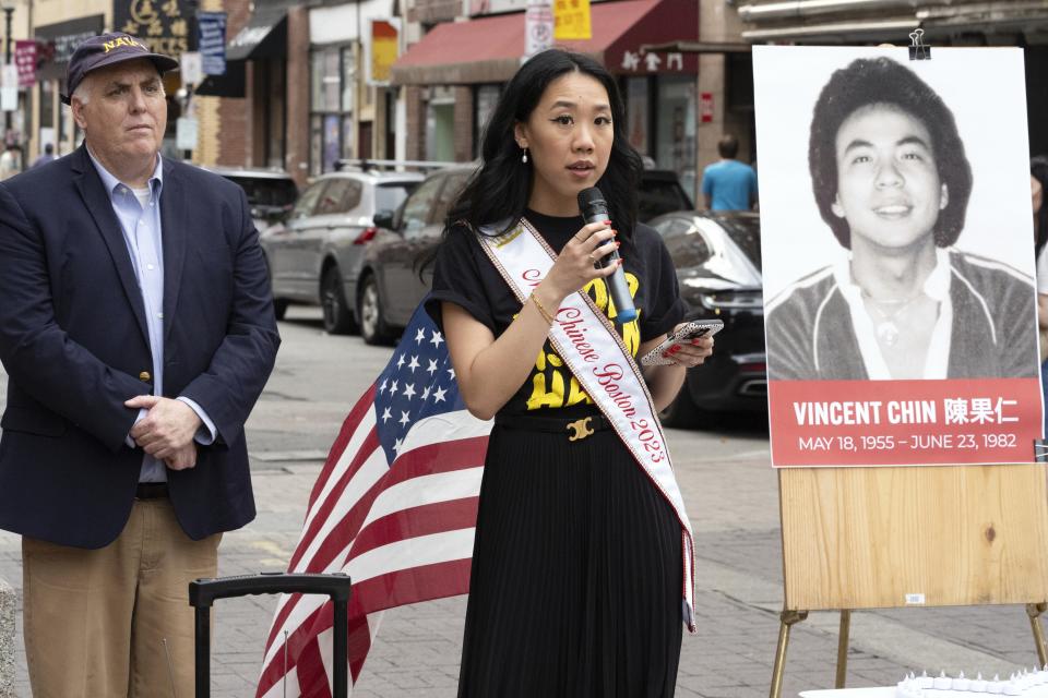 Miss Chinese Boston Sarah Chu speaks beside Boston City Councilor Ed Flynn during a remembrance ceremony for Vincent Chin in Chinatown, Sunday, June 23, 2024, in Boston. Over the weekend, vigils were held across the country to honor the memory of Chin, who was killed by two white men in 1982 in Detroit. (AP Photo/Michael Dwyer)