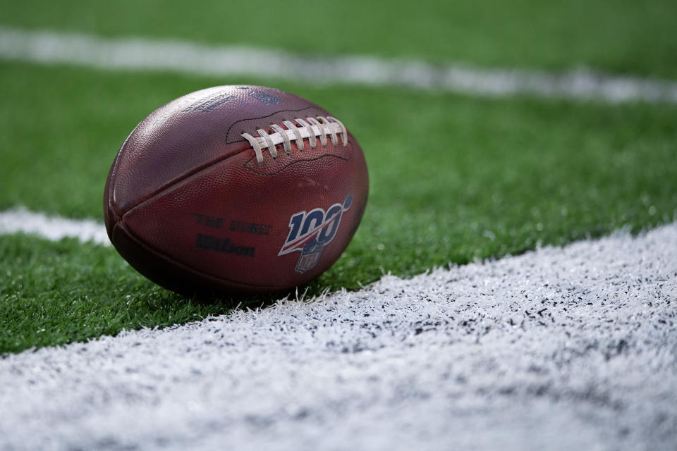 INDIANAPOLIS, IN - AUGUST 24: NFL football with the 100 year logo sits on the field during the week 3 NFL preseason game between the Chicago Bears and Indianapolis Colts on August 24, 2019 at Lucas Oil Stadium, in Indianapolis, IN. (Photo by Zach Bolinger/Icon Sportswire via Getty Images)