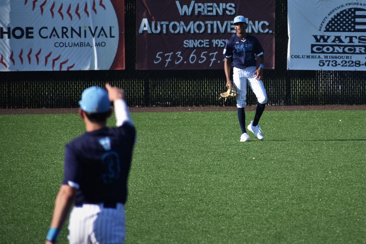 Father Tolton's Jake Ryan (3) points to Cameron Lee after Lee turned a double play during the Trailblazers' 8-6 win over Southern Boone on Thursday.