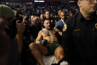 Conor McGregor is carried off on a stretcher after losing to Dustin Poirier in a UFC 264 lightweight mixed martial arts bout Saturday, July 10, 2021, in Las Vegas. (AP Photo/John Locher)