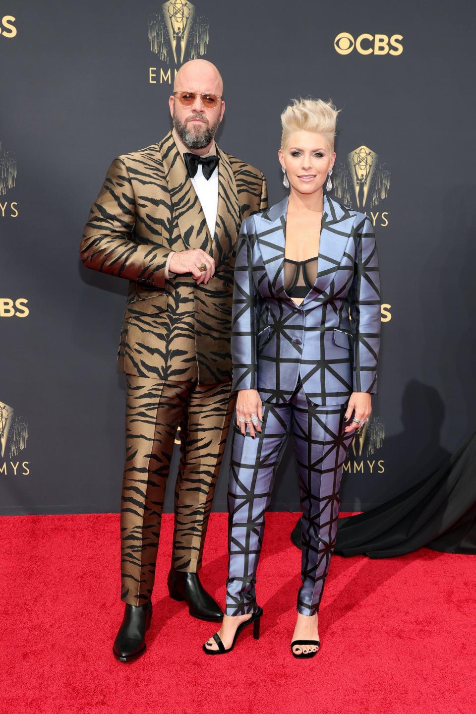 Chris and Rachel Sullivan wear animal print suits on the Emmys red carpet.