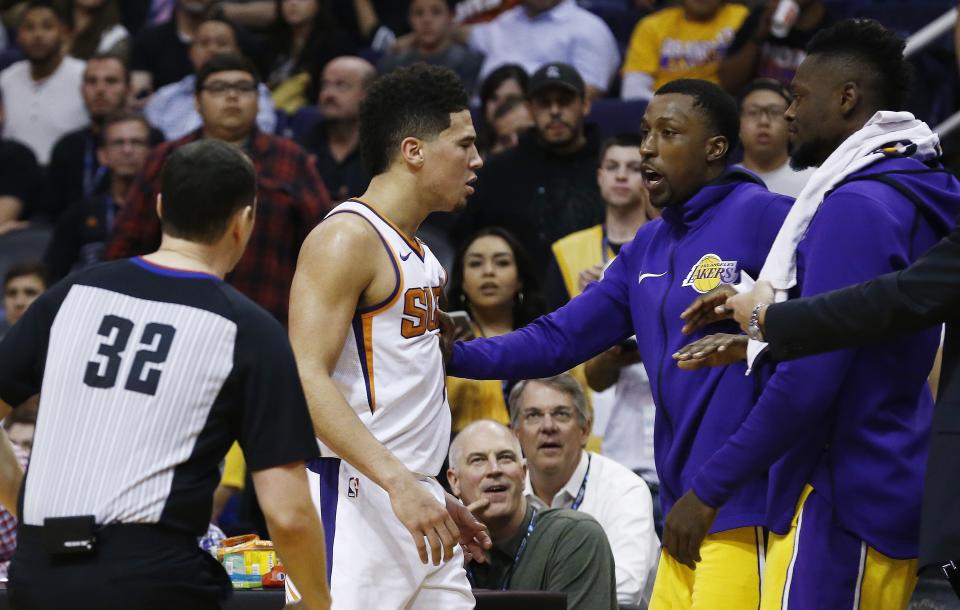 Suns sensation Devin Booker approaches the Lakers’ bench. (AP)