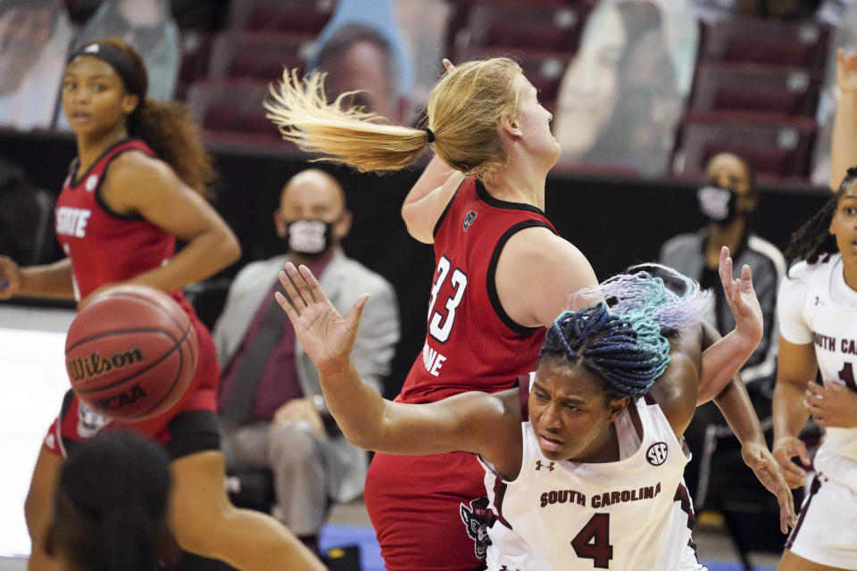 South Carolina forward Aliyah Boston (4) and North Carolina State center Elissa Cunane (33) vie for a rebound during the first half of an NCAA college basketball game Thursday, Dec. 3, 2020, in Columbia, S.C. (AP Photo/Sean Rayford)