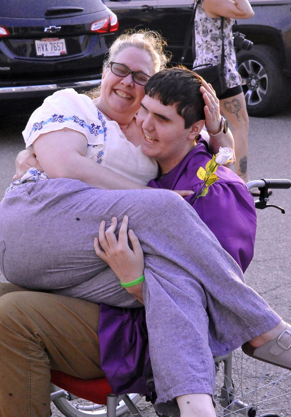 Christian Mendoza and his mom Heather Garnes share a special moment after the graduation ceremony at Triway Local.