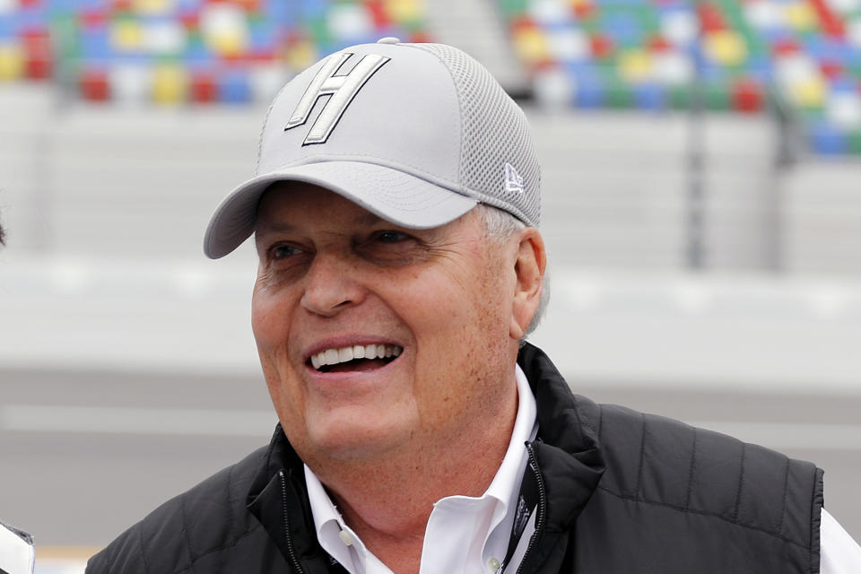 FILE - NASCAR team owner Rick Hendrick laughs on pit road during qualifying for the Daytona 500 auto race at Daytona International Speedway, in Daytona Beach, Fla., Feb. 10, 2019. Hendrick believes in setting goals because chasing that dangling carrot has proved to be an effective motivator for NASCAR’s winningest team. (AP Photo/Terry Renna, File)