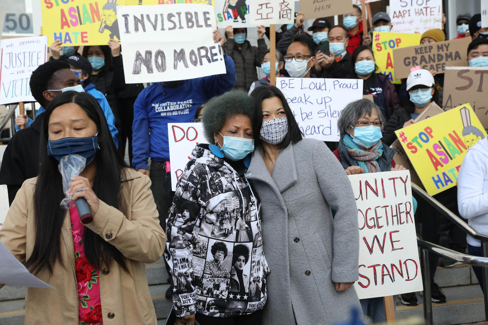 Mattie Scott (center, left to right), founder and Executive Director of Healing 4 Our Families & Our Nation and Nancy Tung, public safety advocate, hold each other as they rally with demonstrators rallying in front of the Hall of Justice as they demand justice for Vicha Ratanapakdee on March 22 in San Francisco<span class="copyright">Lea Suzuki—The San Francisco Chronicle/Getty Images</span>