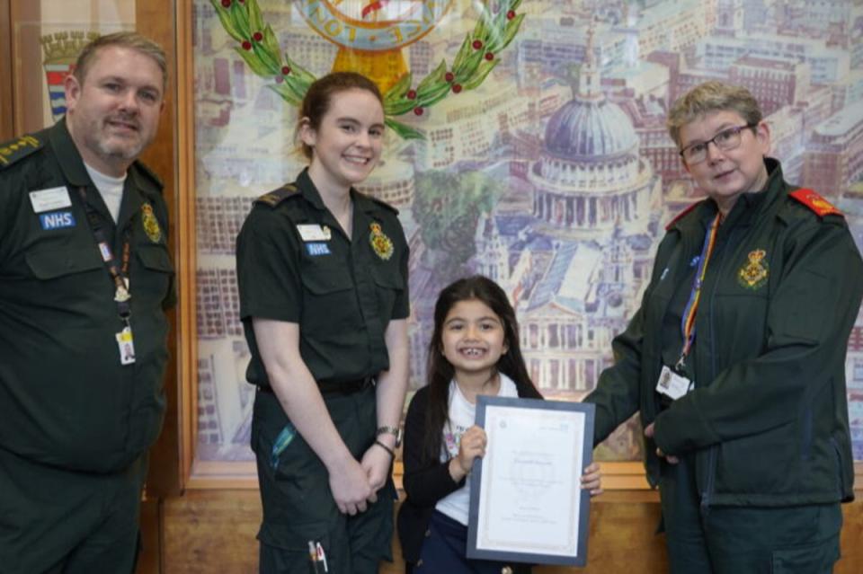 Zaynab Qasim pictured with LAS Chief Medical Officer Dr Fenella Wrigley, Director of 999 Operations Stuart Crichton, and call handler Natasha White at LAS headquarters (London Ambulance Service)