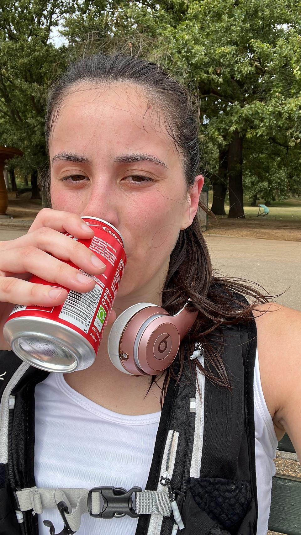 The author sipping on a Coca Cola after completing an 18km run.
