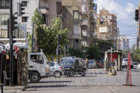 Lebanese army blocks a road by barbed wire that leads to the Ain el-Rumaneh neighborhood after the deadly clashes that erupted last Thursday along a former 1975-90 civil war front-line between Muslim Shiite and Christian areas, in Beirut, Lebanon, Tuesday, Oct. 19, 2021. The shootout on the streets of Beirut between rival Christian and Muslim groups has revived memories of the country's 1975-90 civil war and fired up sectarian passions in a country that never dealt with the causes of its violent past. (AP Photo/Hassan Ammar)