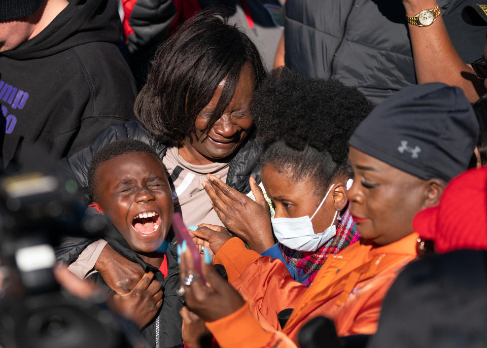 Jamie Cooper Jr., left, with his mother Dana Roberts and sister, Johneya Beckham, react as they listen to guilty verdicts for the defendants in the trial of the killers of Ahmaud Arbery on Wednesday in Brunswick, Georgia.