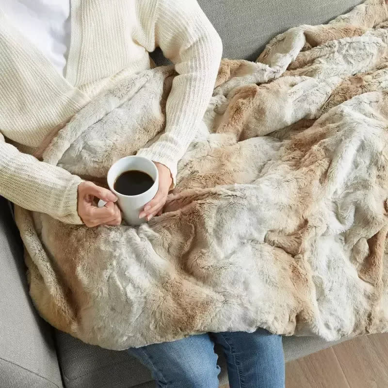 Snuggle up with this ultra-cozy faux-fur weighted blanket with a removable, machine-washable cover. The warm stripes make it look like a real fur blanket, giving a little boho cabin look to your space. It comes in three colors in 12 and 18 pounds and is 60 inches by 70 inches. Promising review: 